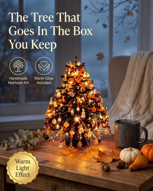 Halloween edition: the lit Halloween tree on a wooden table by a window, with a mug and pumpkins