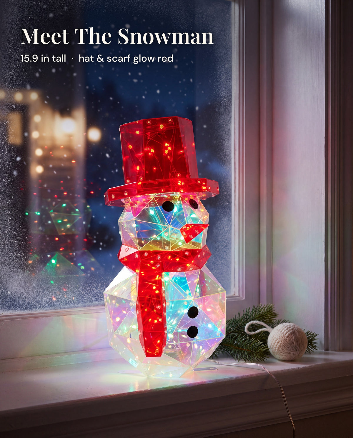 The snowman figure lit on a frosty windowsill
