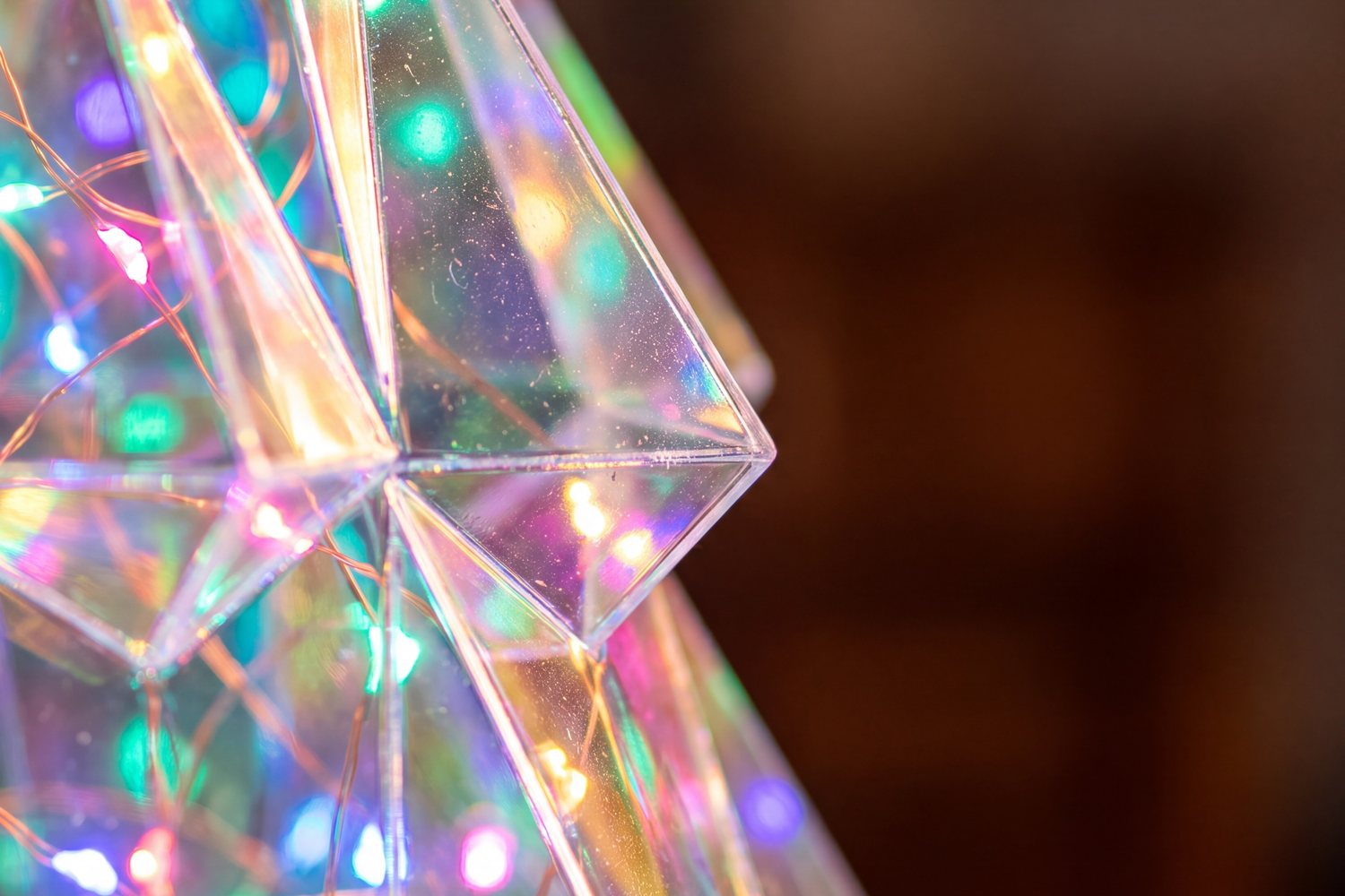 Close-up of the faceted iridescent panels with tiny LED lights inside